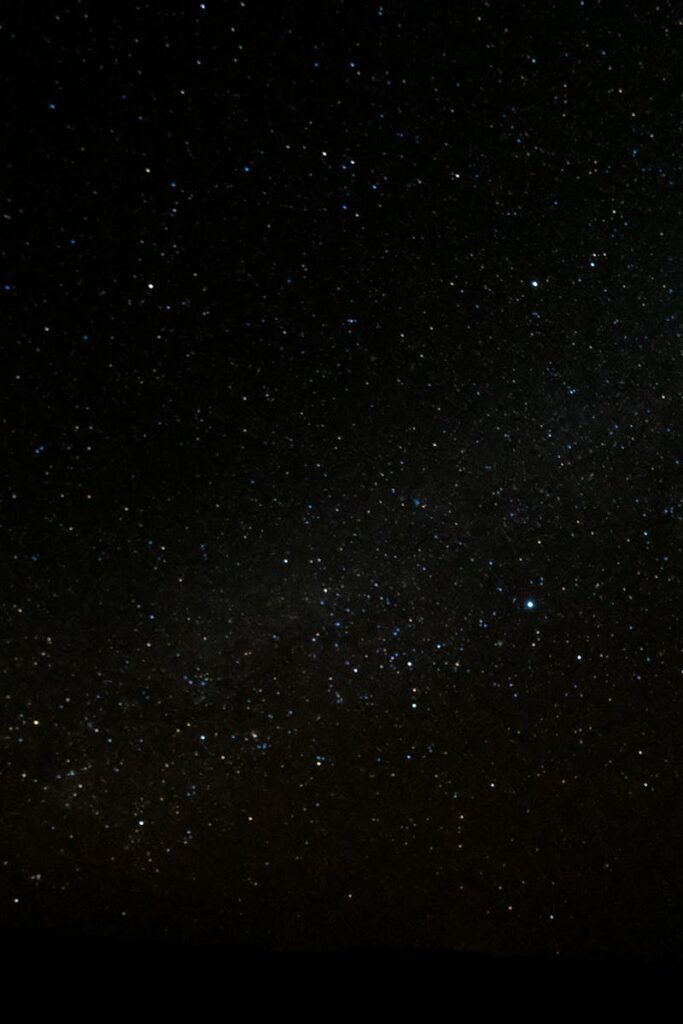 Capture of the starry night sky over Ksar Tanamouste, Morocco, showcasing a vibrant universe.